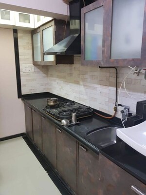 Kitchen in 2 BHK Apartment at Model Town, Andheri West – for Rent