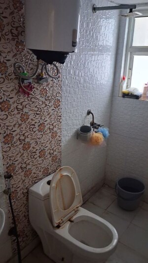 Bathroom in 2 BHK Apartment at Aims Golf City, Sector 75 – for Rent