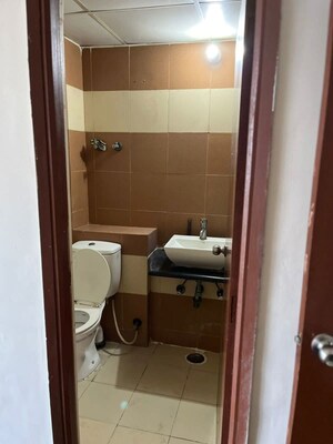 Bathroom in 3 BHK Apartment at Town Park White Orchid, Sector 16c Greater Noida – for Rent