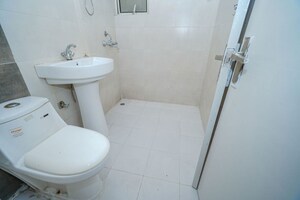 Bathroom in 2 BHK Apartment at MCC Signature Heights, Raj Nagar Extension – for Sale