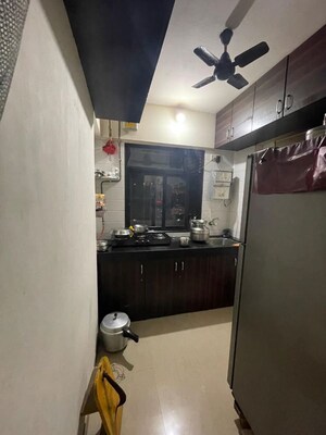Kitchen in 1 BHK Apartment at Raunak Heights, Ghodbunder Road – for Sale