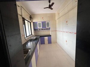 Kitchen in 1.5 BHK Apartment at Dosti West County, Balkum Pada – for Sale