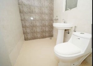 Bathroom in 3 BHK Apartment at Raj Nagar Extension – for Sale