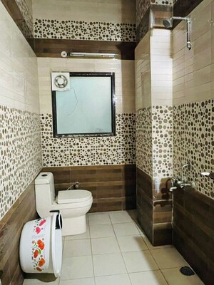 Bathroom in 3 BHK Builder Floor at Migsun Alpha Central, Alpha Ii Greater Noida – for Rent