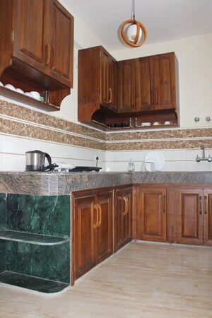 Kitchen in 2 BHK Apartment at Mahaluxmi Migsun Ultimo, Omicron Iii Greater Noida – for Rent
