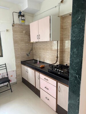 Kitchen in 1 BHK Apartment at Ajmera Odyessey Apartment, Bhakti Park – for Rent