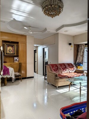 Living Room in 2 BHK Apartment at Abrol Krishna Utsav, Malad West – for Rent