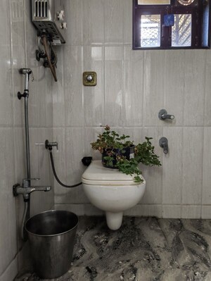 Bathroom in 2 BHK Apartment at Abrol Krishna Utsav, Malad West – for Rent