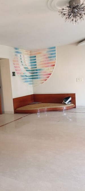 Living Room in 4 BHK Apartment at Indradarshan II, Oshiwara – for Sale