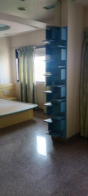 Living Room in 4 BHK Apartment at Indradarshan II, Oshiwara – for Sale