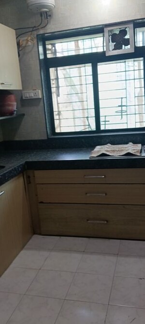 Kitchen in 4 BHK Apartment at Indradarshan II, Oshiwara – for Sale