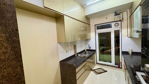 Kitchen in 2 BHK Apartment at Rustomjee Athena, Majiwada – for Rent