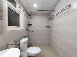 Bathroom in  Apartment at Bhartiya Nikoo Homes Phase 2, Thanisandra Main Road – for Rent