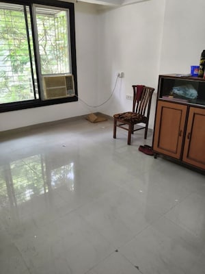 Room in 2 BHK Apartment at Manyata CHS, Tilak Nagar – for Rent