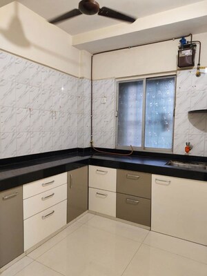 Kitchen in 2 BHK Apartment at Riddhi Garden, Malad East – for Rent