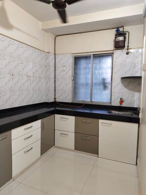 Kitchen in 2 BHK Apartment at Riddhi Garden, Malad East – for Rent