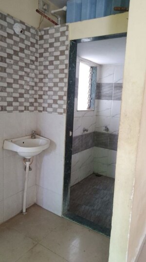 Bathroom in 1 BHK Apartment at Sadguru Landmark, Titwala – for Sale