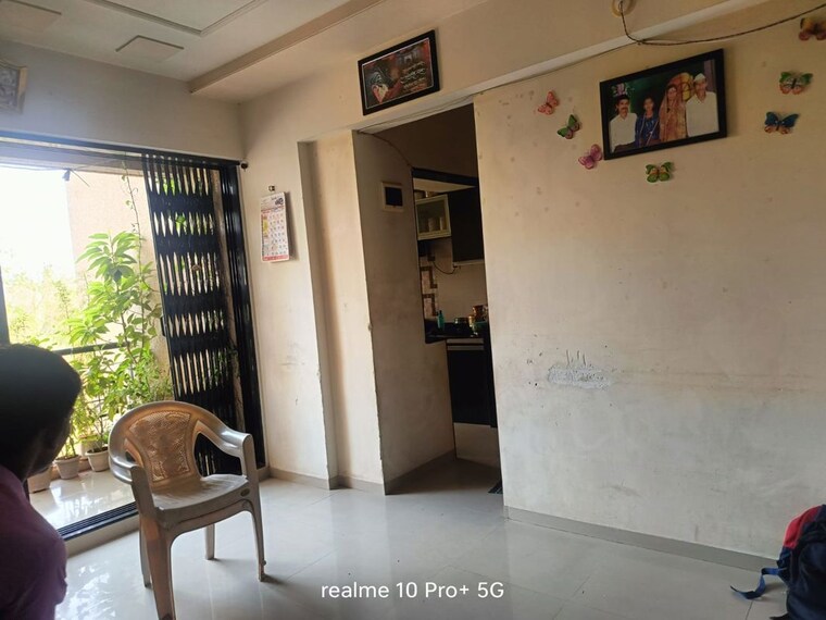 Living Room, charms-paradise 1 Bedroom 450 Sq.Ft. Apartment In Titwala Thane 10397192