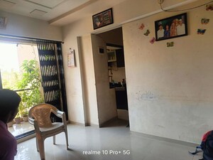 Living Room in 1 BHK Apartment at Charms Paradise, Titwala – for Sale