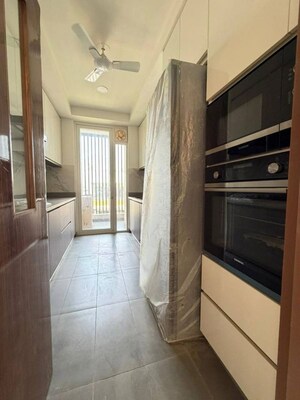 Kitchen in 3 BHK Apartment at DLF Exclusive Floors, Sector 53 – for Sale