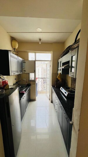 Kitchen in 2 BHK Apartment at Prateek Wisteria, Sector 77 – for Rent