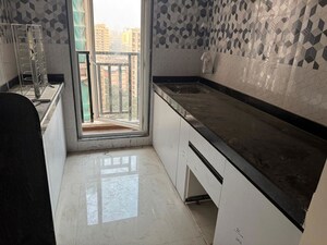 Kitchen in 1 BHK Apartment at Raunak Bliss B1, Ghodbunder Road – for Rent