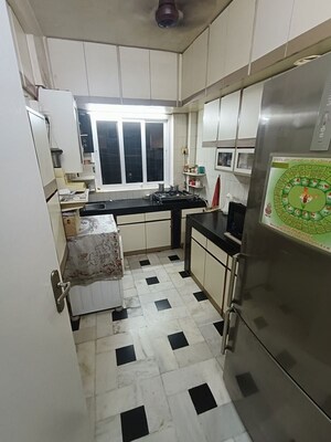 Kitchen in 2 BHK Apartment at Chanchal Kalyan Complex, Yari Road – for Rent