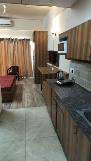 Kitchen in 1 RK Apartment at Paramount Golf Forest Studio Apartments - OAK Towe, Zeta I Greater Noida – for Rent