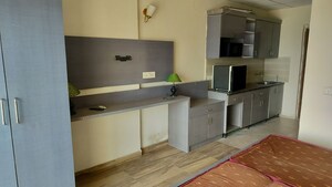 Kitchen in 1 RK Apartment at Paramount Golf Forest Studio Apartments - OAK Towe, Zeta I Greater Noida – for Rent