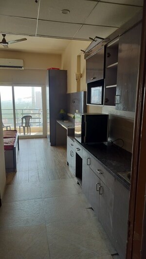 Kitchen in 1 RK Apartment at Paramount Golf Forest Studio Apartments - OAK Towe, Zeta I Greater Noida – for Rent