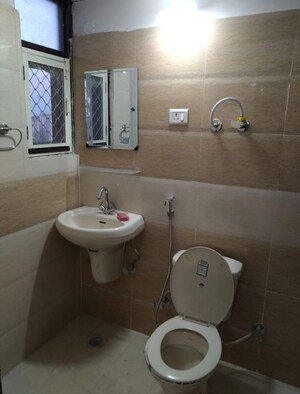 Bathroom in 2 BHK Apartment at KM Residency, Raj Nagar Extension – for Rent