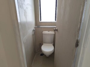 Bathroom in 1 BHK Apartment at Runwal Gardens, Dombivli East – for Rent