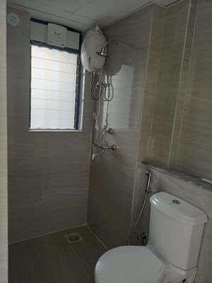 Bathroom in 1 BHK Apartment at Runwal Gardens, Dombivli East – for Rent
