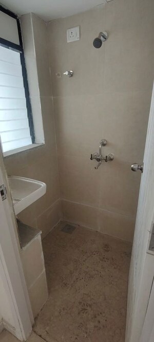 Bathroom in 1 BHK Apartment at Runwal Gardens, Dombivli East – for Rent