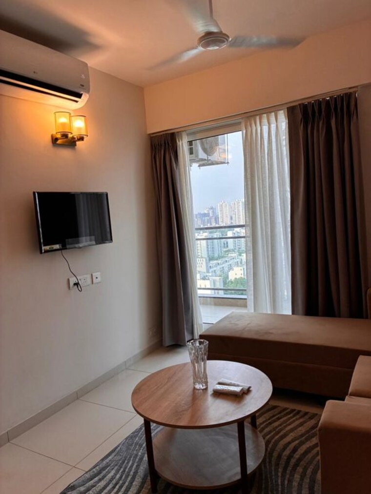 Living Room, godrej-golf-links-crest 1.5 Bedroom 975 Sq.Ft. Apartment In Sector 27 Yamuna Expressway Greater Noida 10399273