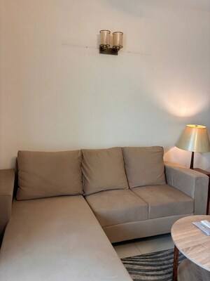 Living Room in 1.5 BHK Apartment at Godrej Golf Links Crest, Sector 27 Yamuna Expressway – for Rent