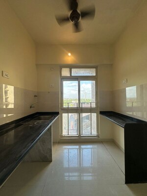 Kitchen in 1 BHK Apartment at Vijay Orovia, Ghodbunder Road – for Sale