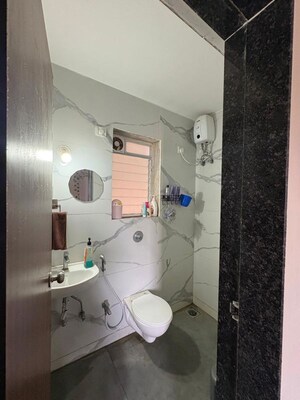 Bathroom in 1 BHK Apartment at Raunak Bliss, Ghodbunder Road – for Rent