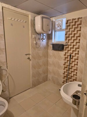 Bathroom in 3 BHK Apartment at Gaur Atulyam, Omicron I Greater Noida – for Rent