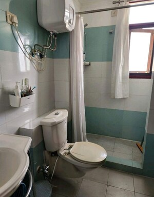Bathroom in 3 BHK Apartment at Purvanchal Heights, Zeta I Greater Noida – for Rent