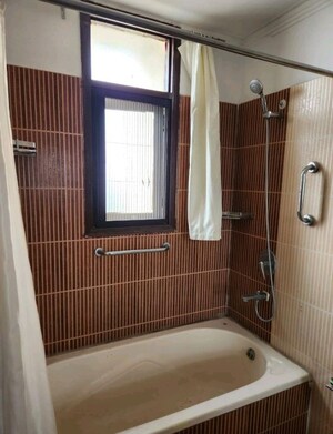 Bathroom in 3 BHK Apartment at Purvanchal Heights, Zeta I Greater Noida – for Rent
