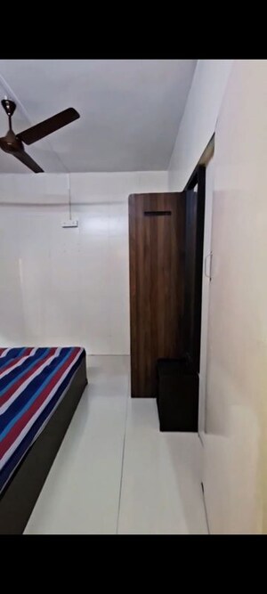 Bedroom in 1 BHK Apartment at Anirudha CHS, Vile Parle East – for Rent
