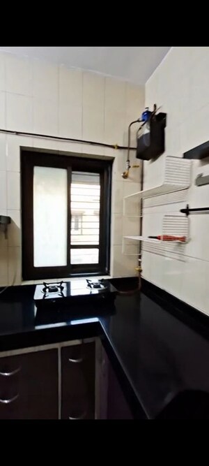 Kitchen in 1 BHK Apartment at Anirudha CHS, Vile Parle East – for Rent