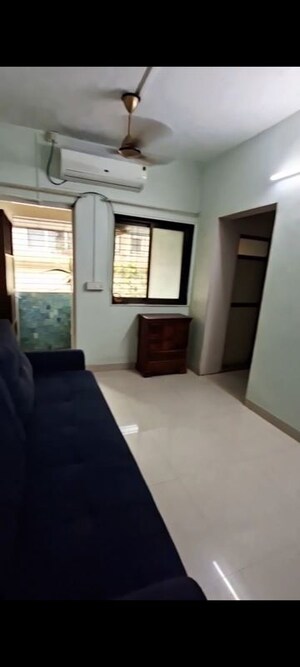 Living Room in 1 BHK Apartment at Anirudha CHS, Vile Parle East – for Rent