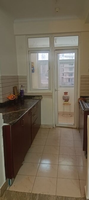 Kitchen in 2 BHK Apartment at Amrapali Silicon City, Sector 76 – for Rent