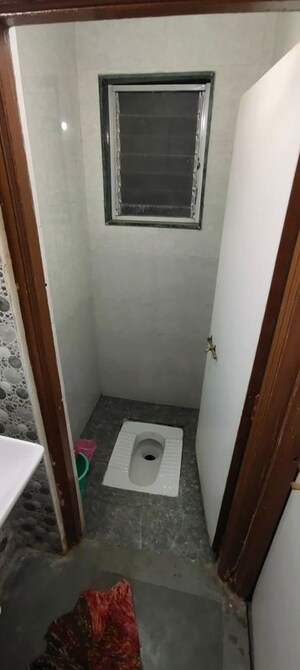 Bathroom in 2 BHK Apartment at Anand Plaza CHS, Wadgaon Sheri – for Rent