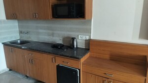 Kitchen in 1 RK Apartment at Paramount Golf Forest Studio Apartments - OAK Towe, Zeta I Greater Noida – for Rent