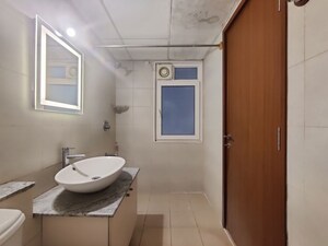 Bathroom in  Apartment at Bhartiya Nikoo Homes Phase 2, Thanisandra Main Road – for Rent