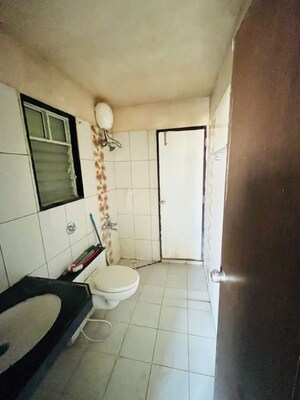 Bathroom in 1 BHK Apartment at Paranjape Forest Trails Pebbles, Bhugaon – for Rent