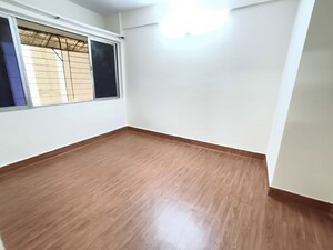 Bedroom in 1 BHK Apartment at Shalmali Cooperative Housing Society, Vasant Vihar – for Rent